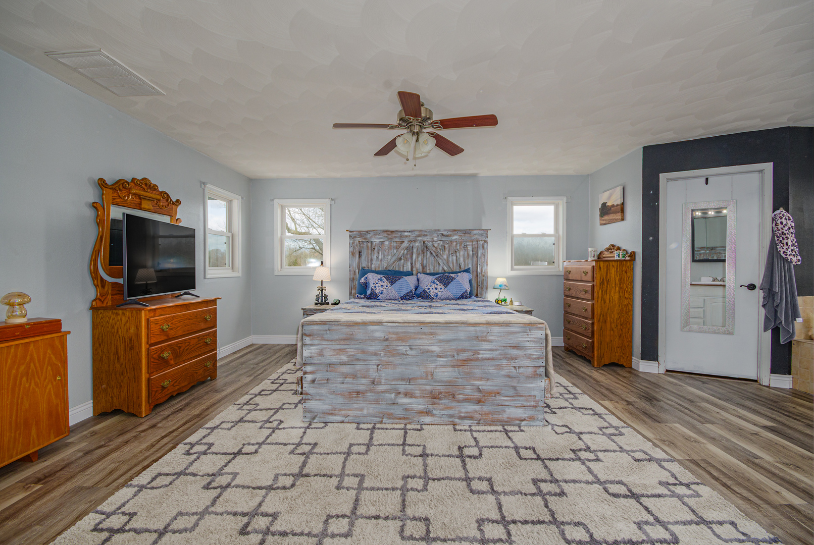 4786 Keller Road Iuka, IL 62849 - Photo 24 of 40 a spacious bedroom with a bed and a flat screen tv