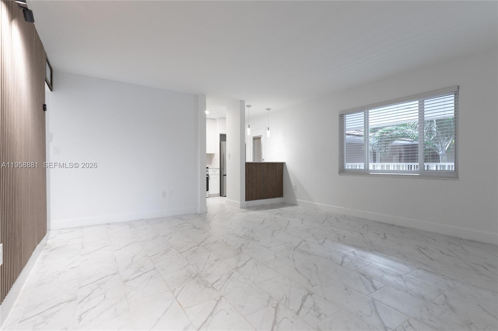 a view of an empty room with a window