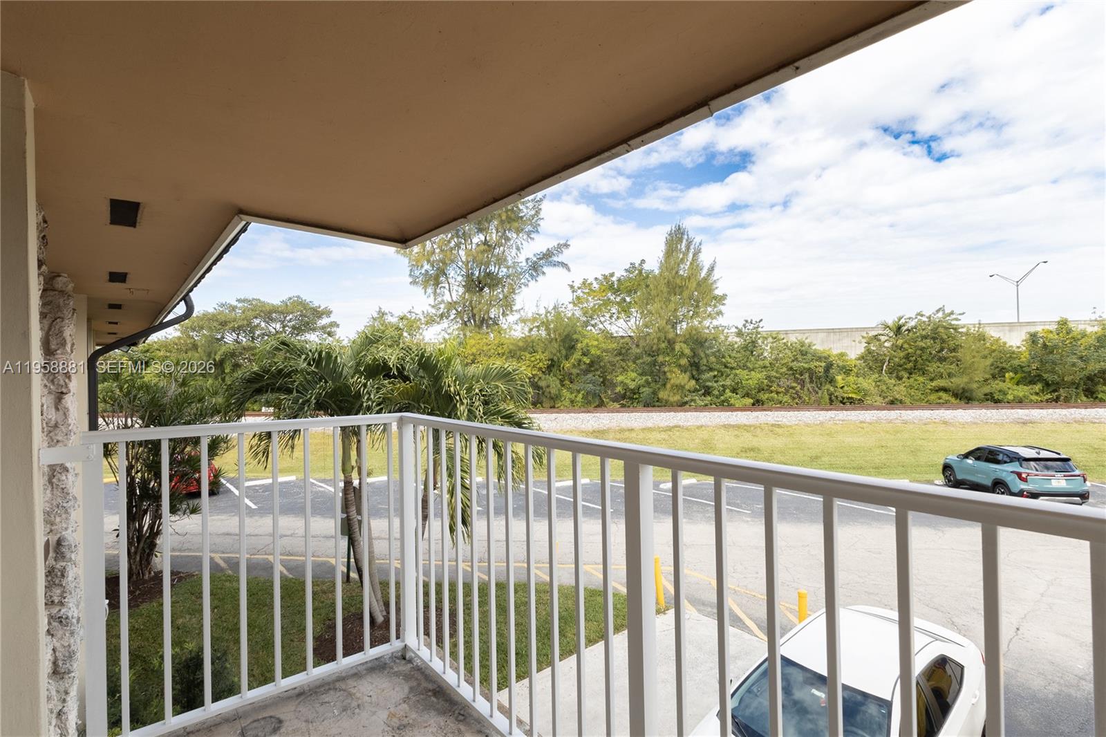 5301 Southwest 77th Court, Unit 201G Miami, FL 33155 - Photo 14 of 17 a view of a balcony with lake view and a ocean view