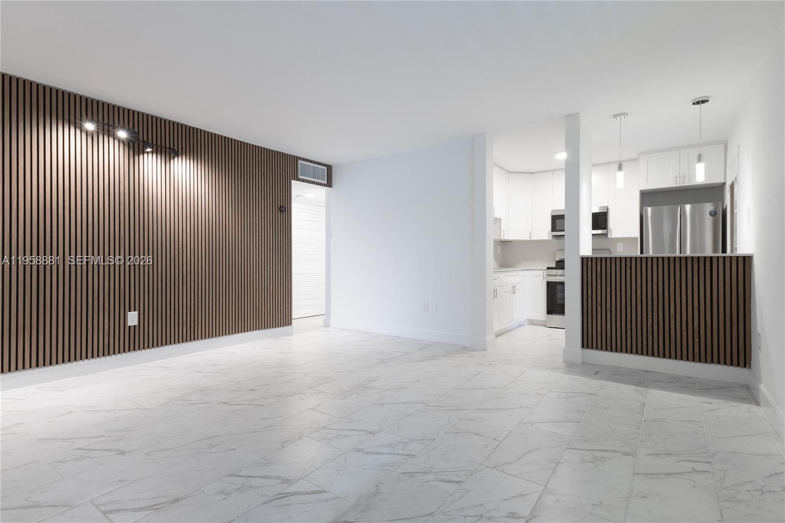 5301 Southwest 77th Court, Unit 201G Miami, FL 33155 - Photo 2 of 17 a view of a hallway