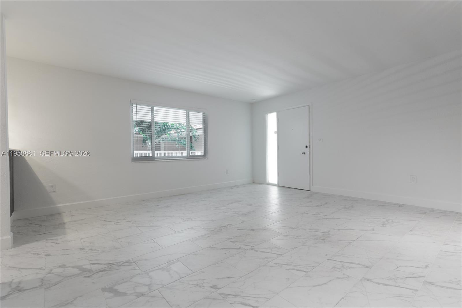 5301 Southwest 77th Court, Unit 201G Miami, FL 33155 - Photo 8 of 17 an empty room with windows