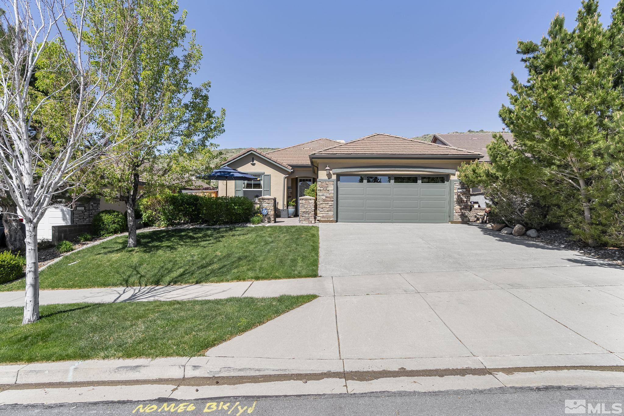 1745 Trail Creek Way Reno, NV 89523 - Photo 1 of 28 a front view of a house with a yard