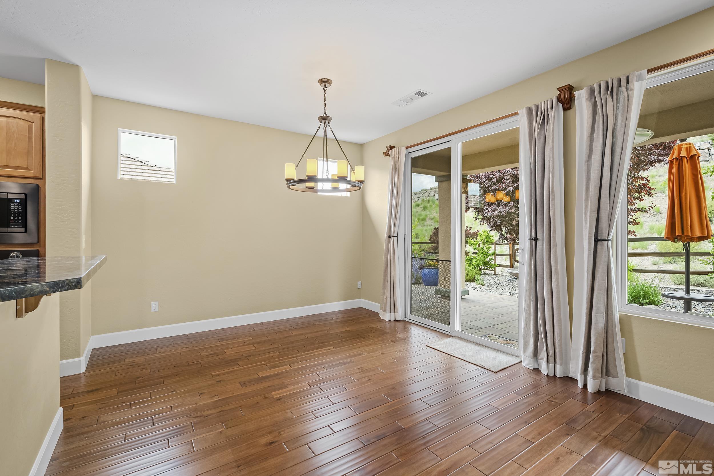 1745 Trail Creek Way Reno, NV 89523 - Photo 11 of 28 a view of empty room with wooden floor and fan
