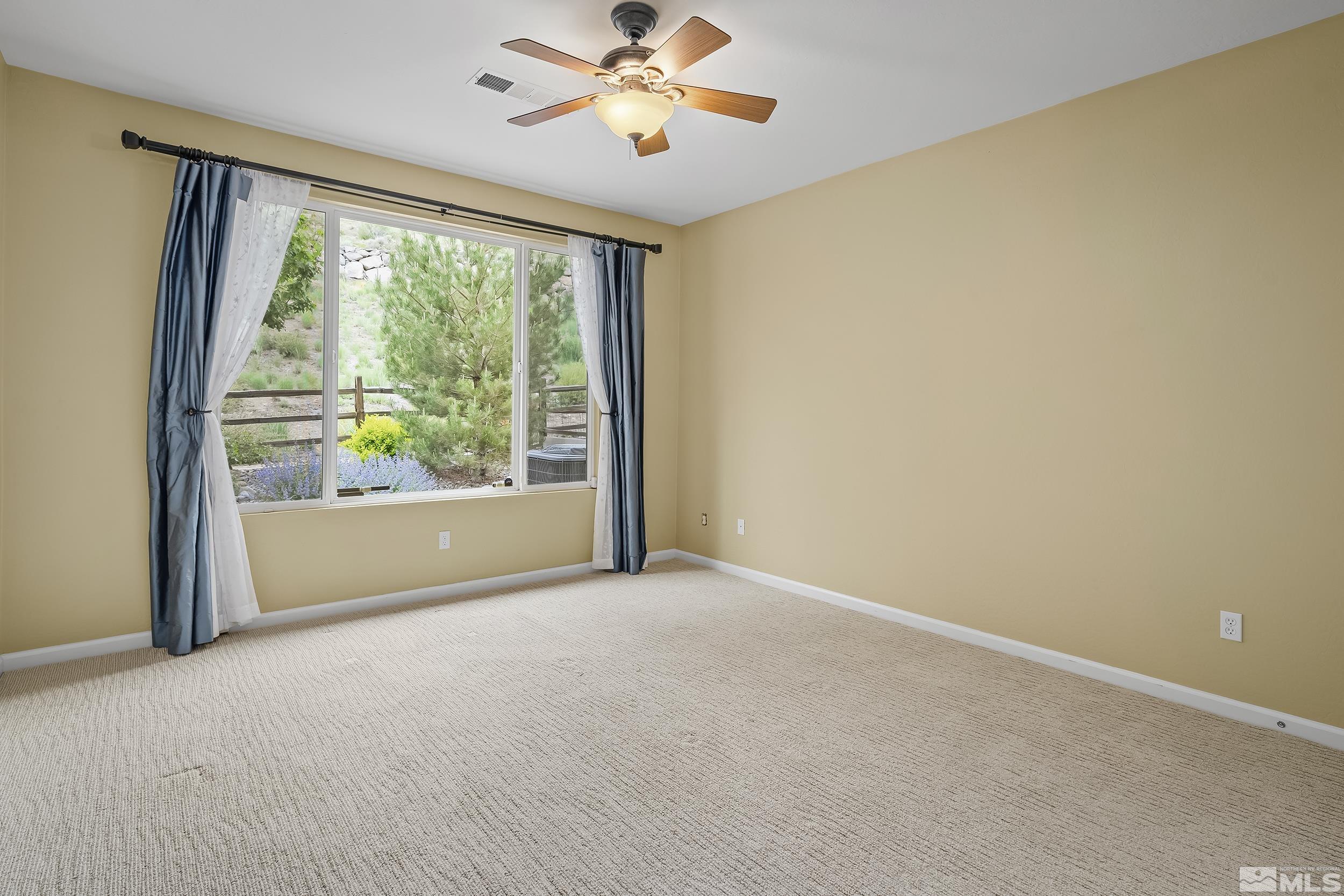 1745 Trail Creek Way Reno, NV 89523 - Photo 16 of 28 wooden floor in an empty room with a window