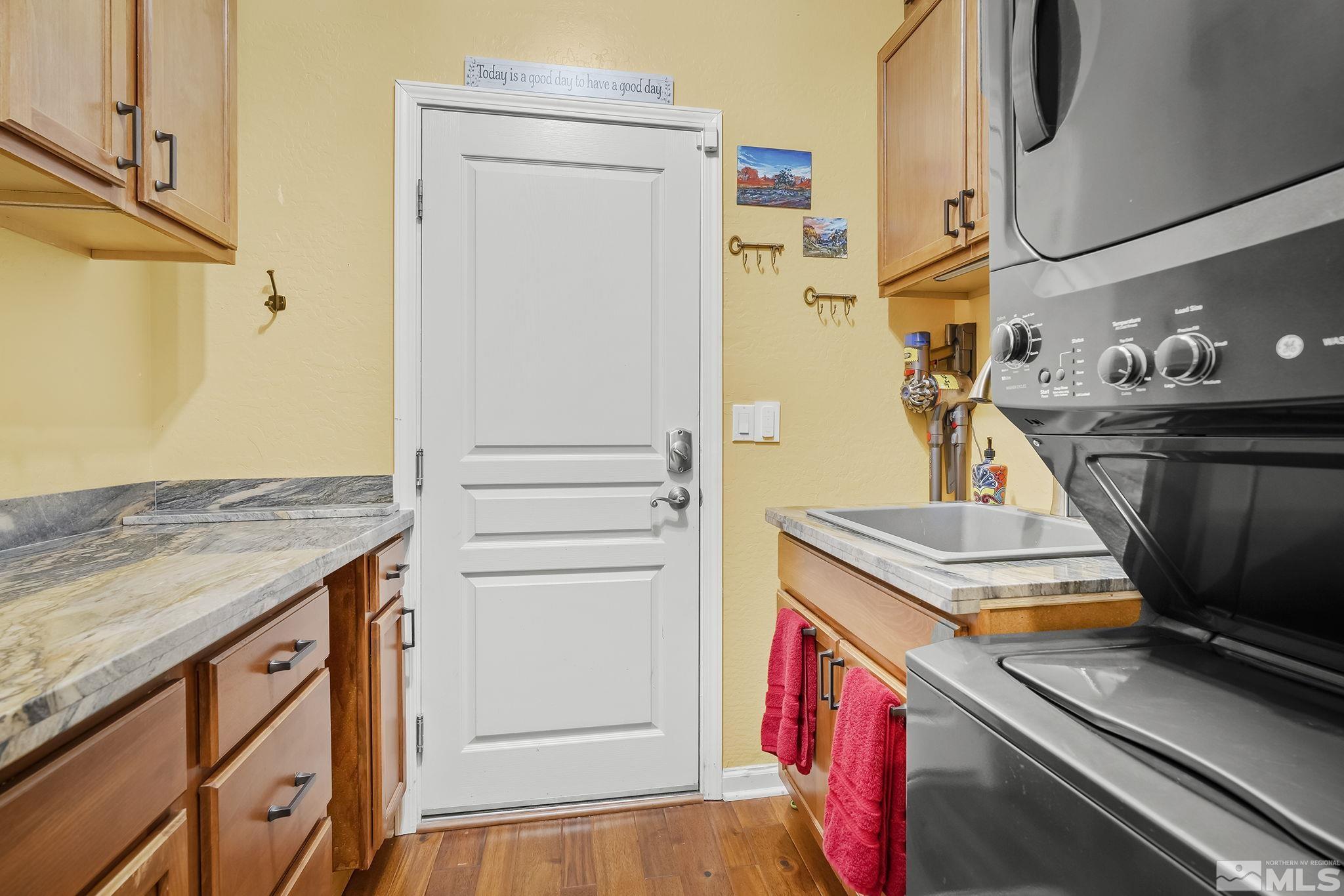 1745 Trail Creek Way Reno, NV 89523 - Photo 20 of 28 a kitchen with stainless steel appliances granite countertop a stove and a refrigerator