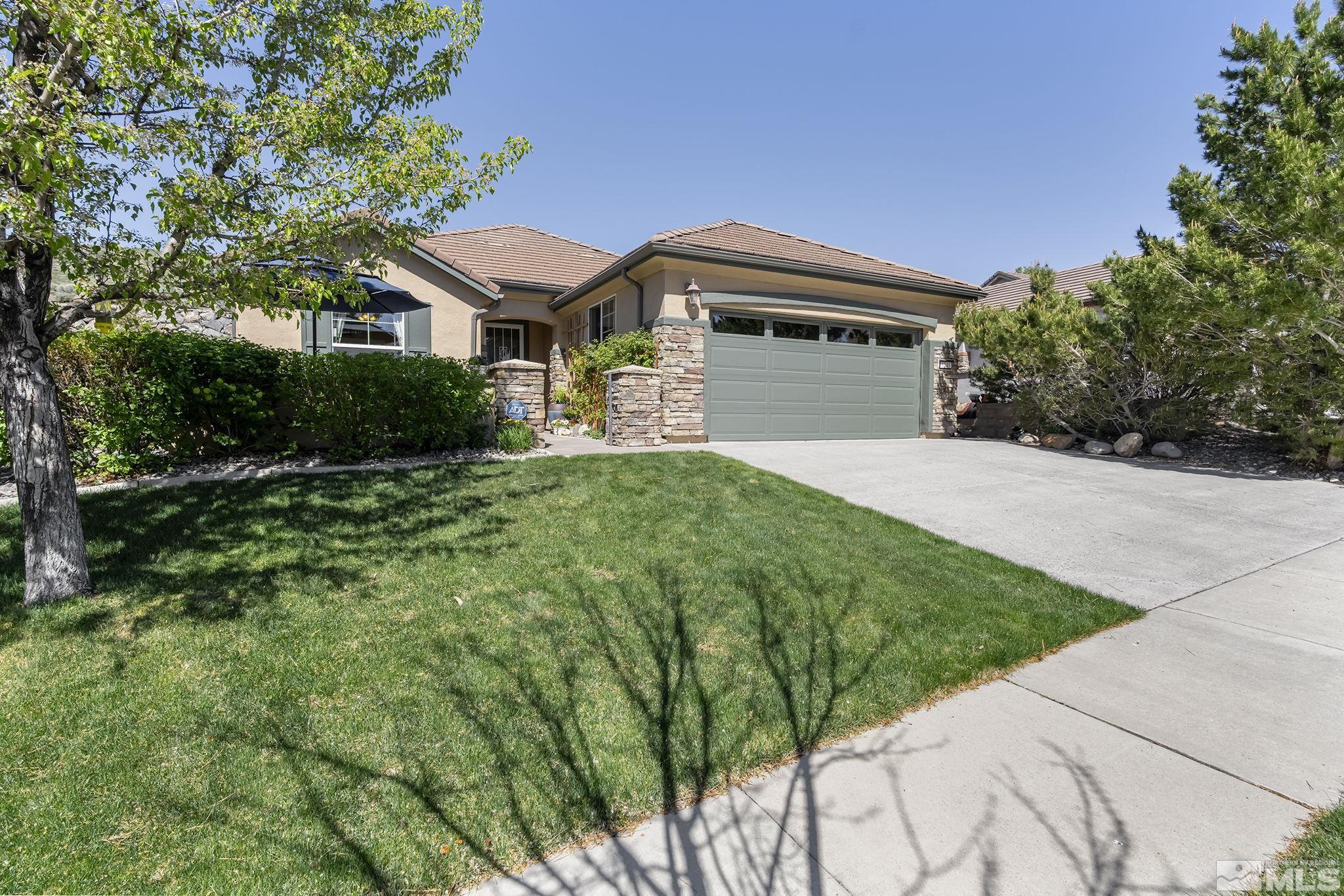 1745 Trail Creek Way Reno, NV 89523 - Photo 2 of 28 a front view of a house with a yard