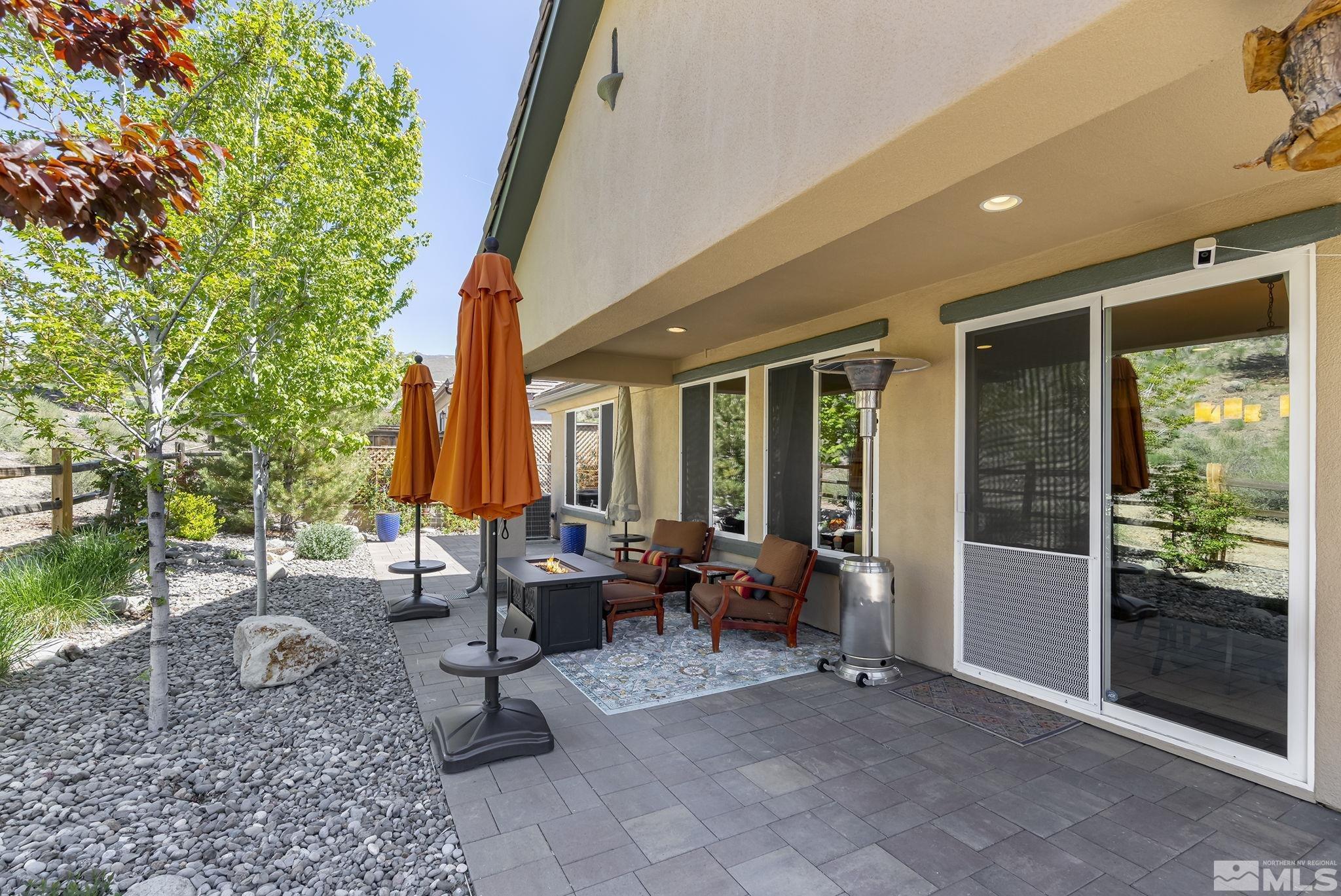 1745 Trail Creek Way Reno, NV 89523 - Photo 24 of 28 a view of a house with backyard sitting area and garden