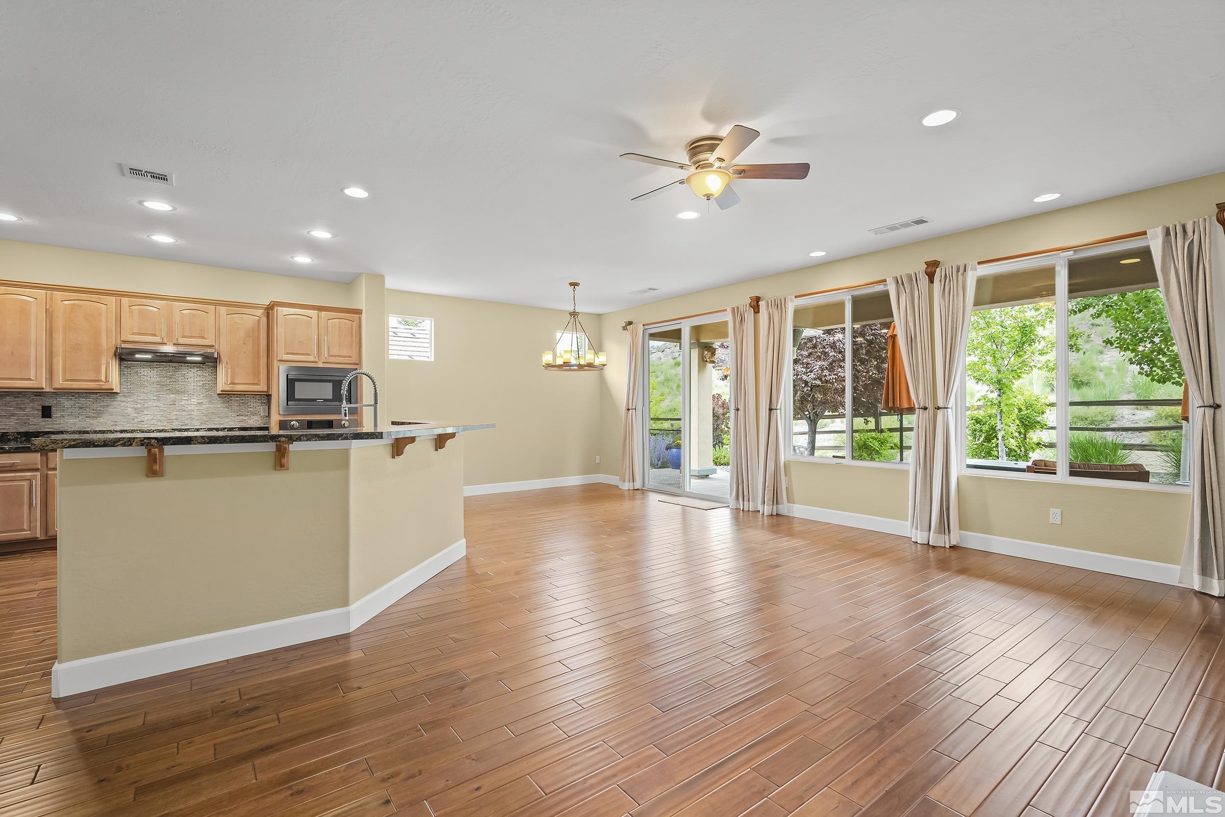 1745 Trail Creek Way Reno, NV 89523 - Photo 5 of 28 a view of a kitchen with wooden floor and a window