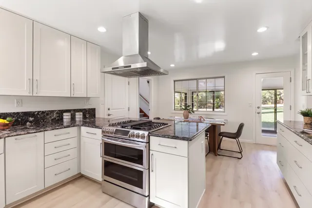 a view of a dining room with furniture and window
