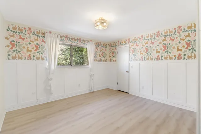 a bathroom with a granite countertop sink a toilet and mirror