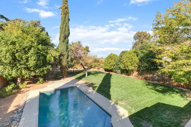 a view of a yard and mountain