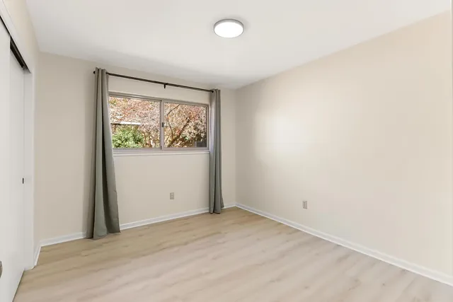 a view of a hallway with stairs