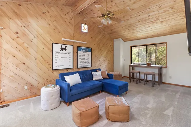 a bathroom with a sink vanity granite tub shower and a mirror