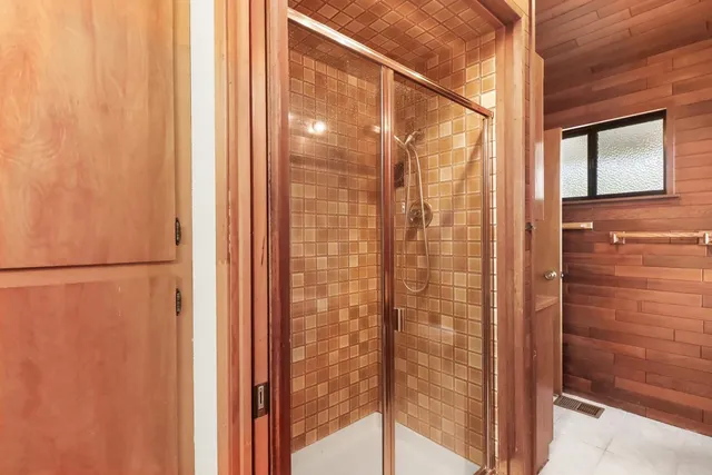 a view of a yard with wooden fence