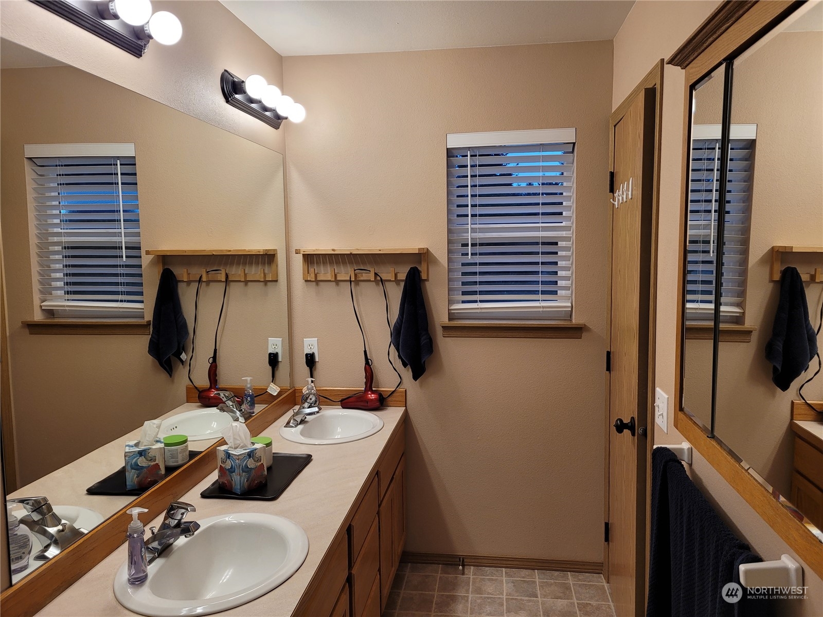 17330 Privet Court Southwest Rochester, WA 98579 - Photo 21 of 25 a bathroom with a sink a toilet and mirror