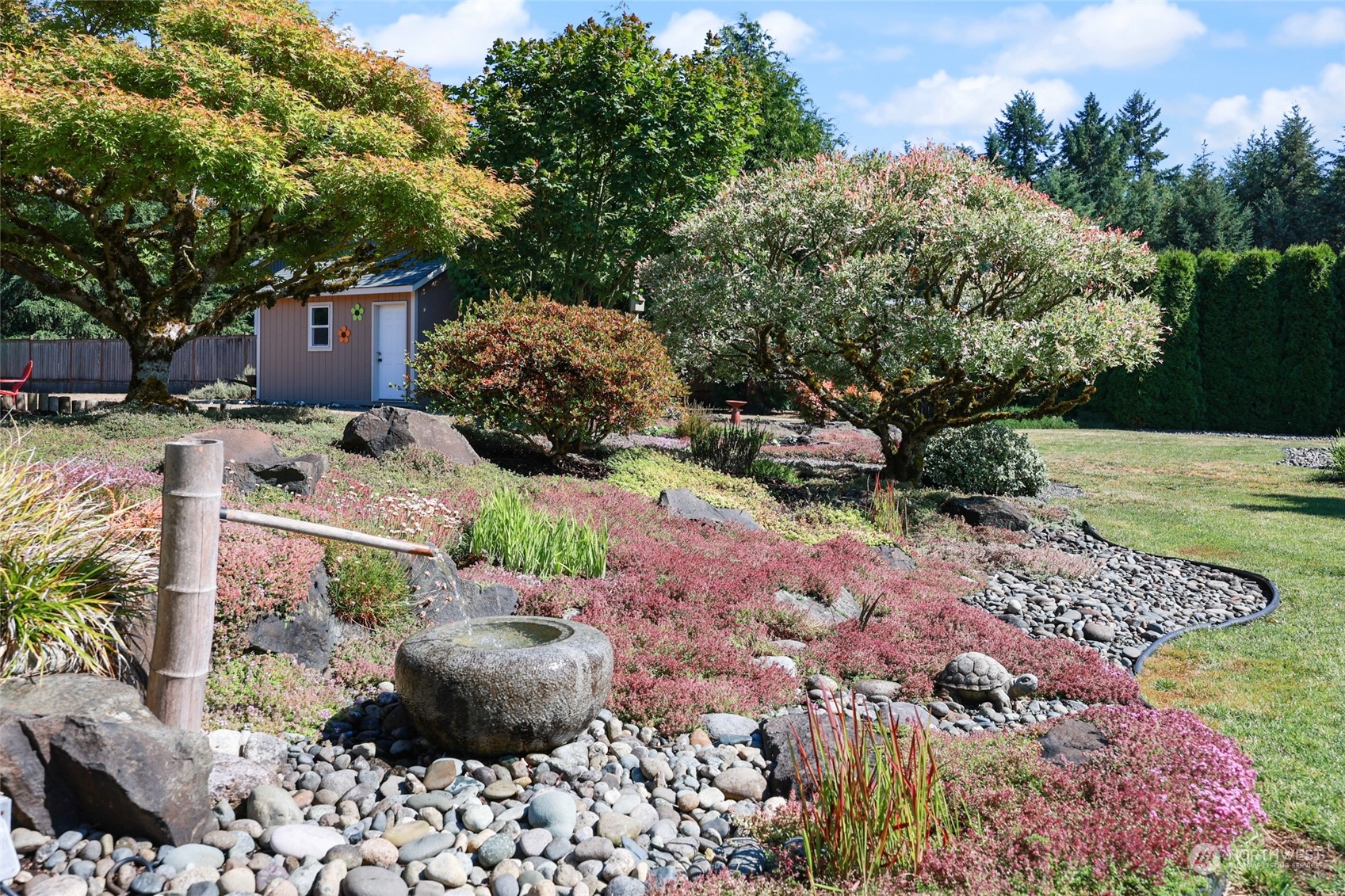 17330 Privet Court Southwest Rochester, WA 98579 - Photo 5 of 25 a view of a backyard with potted plants and large trees