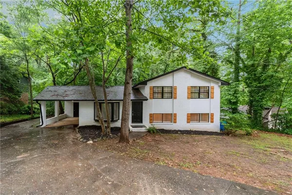 a front view of a house with garden
