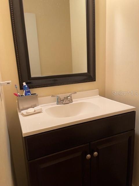 2305 Northeast 38th Street Ocala, FL 34479 - Photo 18 of 34 a bathroom with a sink and a mirror