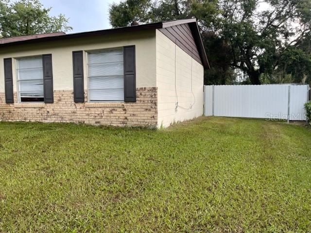 2305 Northeast 38th Street Ocala, FL 34479 - Photo 2 of 34 a view of a house with a yard