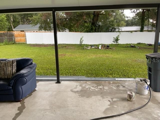 2305 Northeast 38th Street Ocala, FL 34479 - Photo 28 of 34 a view of a living room and floor to ceiling windows