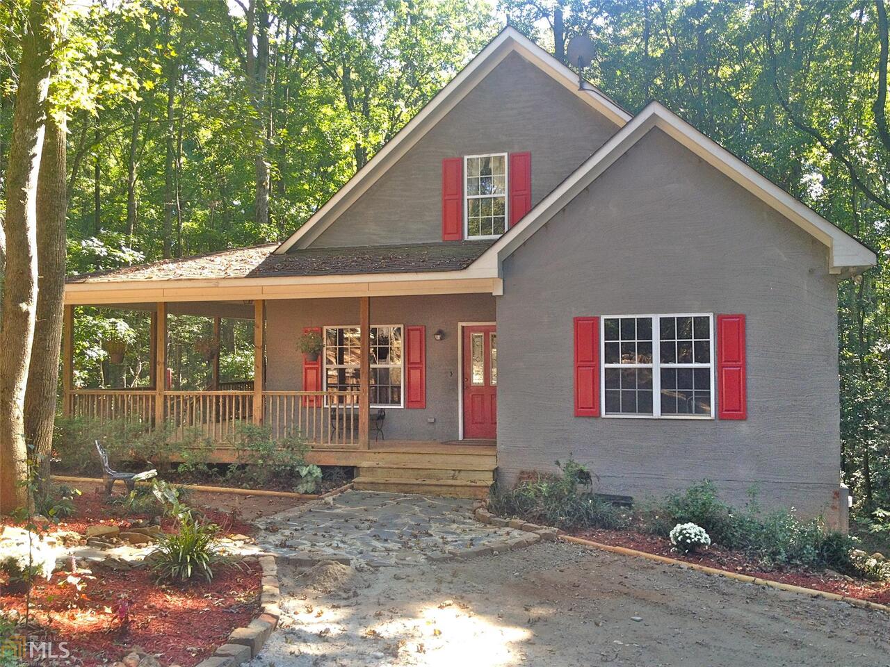 1926 Holiday Cemetary Road, Unit 11 Jefferson, GA 30549 - Photo 1 of 1 a front view of a house with garden