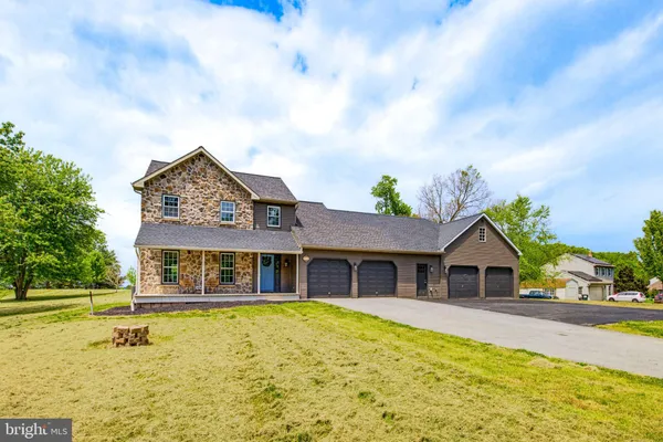 a front view of house with yard swimming pool and seating
