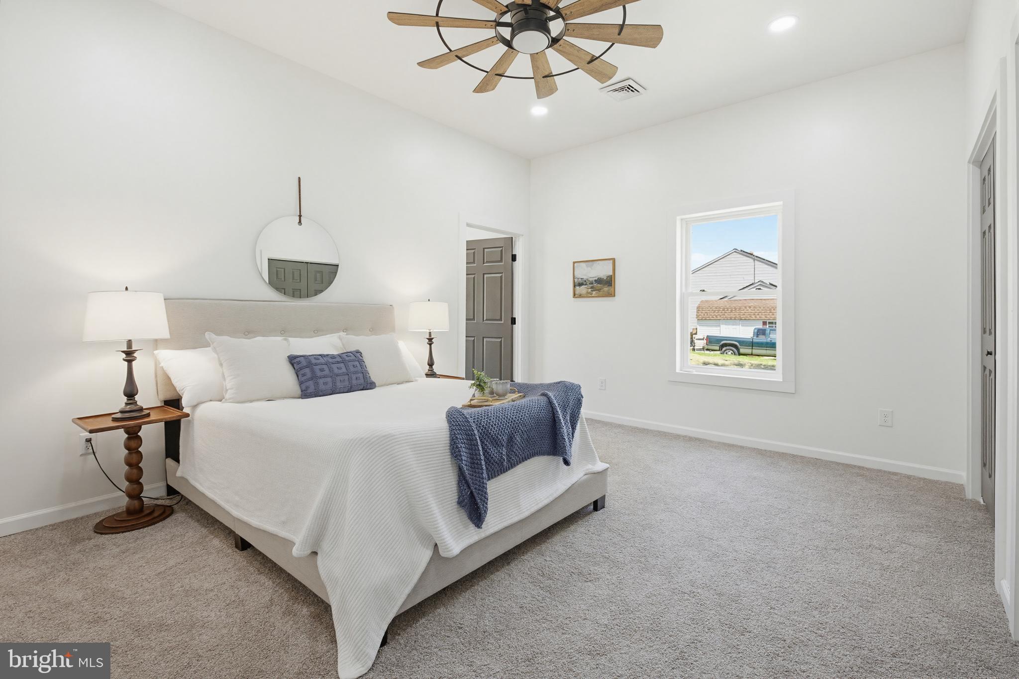 112 Sawmill Road Elizabethtown, PA 17022 - Photo 22 of 56 a spacious bedroom with a bed and a chandelier