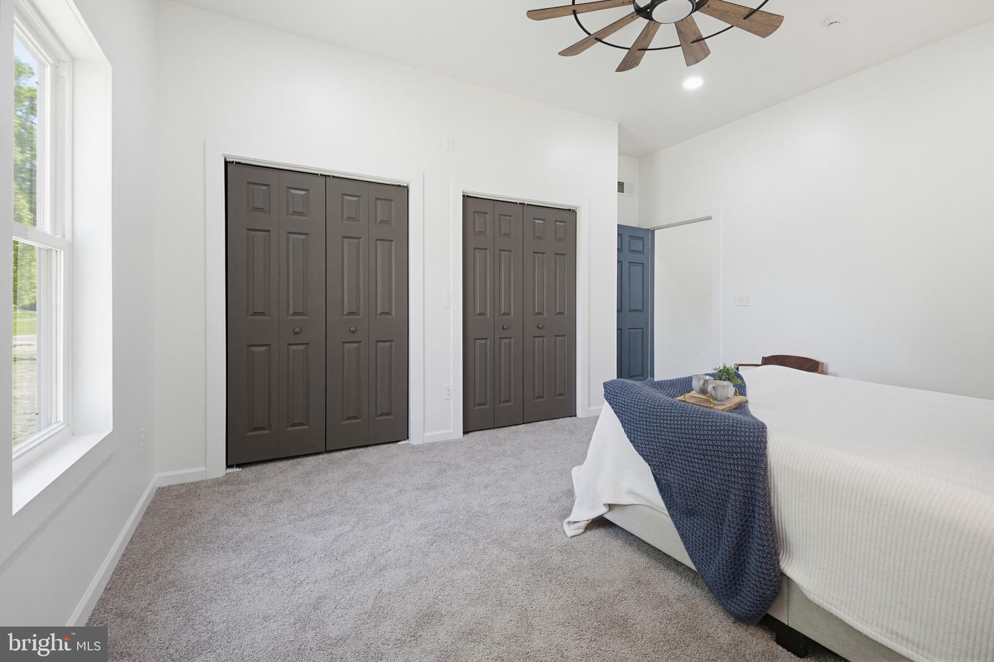 112 Sawmill Road Elizabethtown, PA 17022 - Photo 23 of 56 a bed room with a bed and a chandelier
