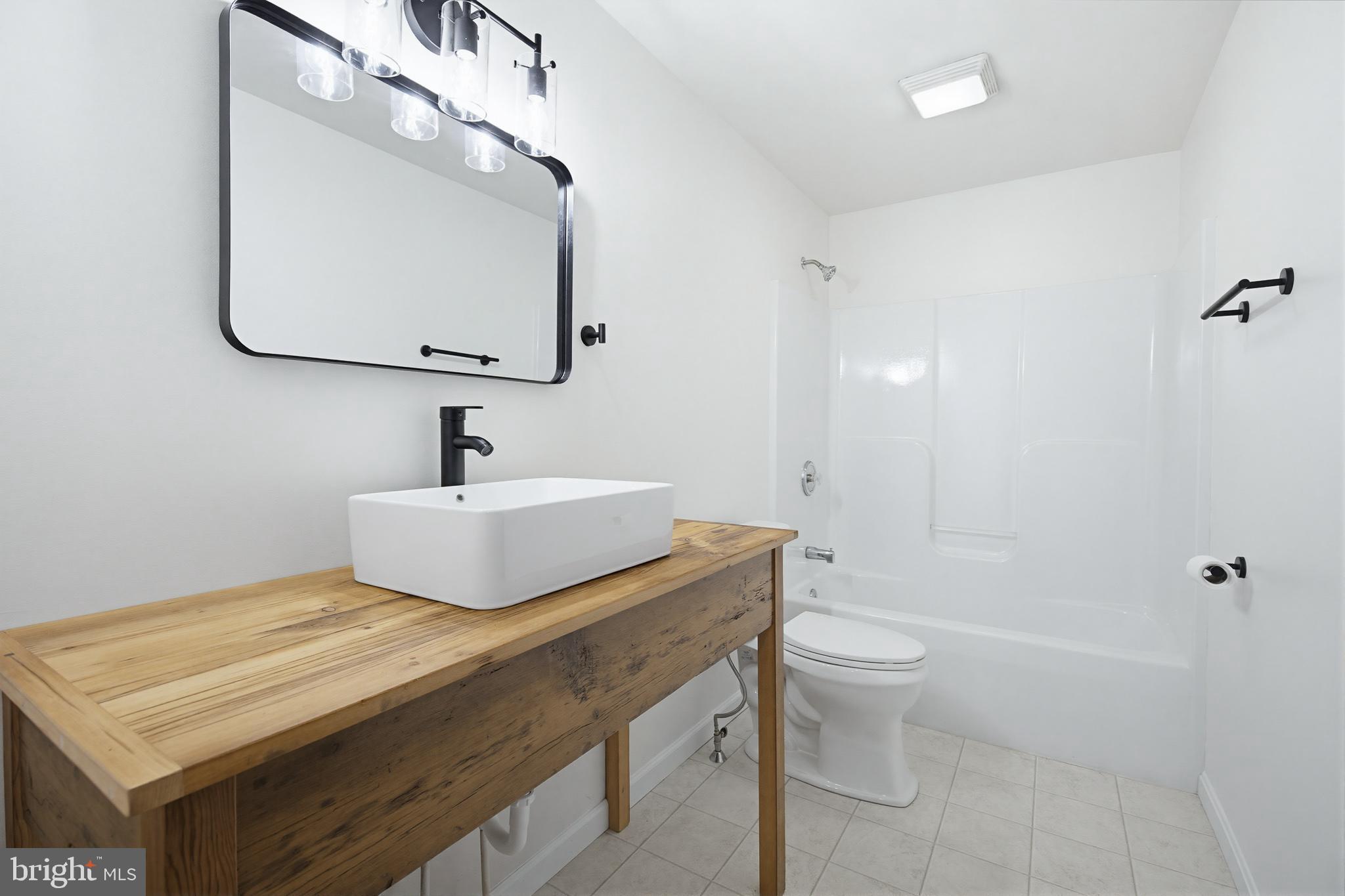 112 Sawmill Road Elizabethtown, PA 17022 - Photo 6 of 56 a bathroom with a sink a toilet and a mirror