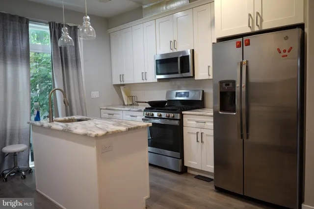 a view of a bathroom with a sink and a bathtub