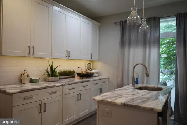 a bedroom with a bed and a chair