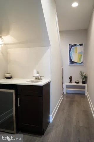a bedroom with a bed and a tv on table