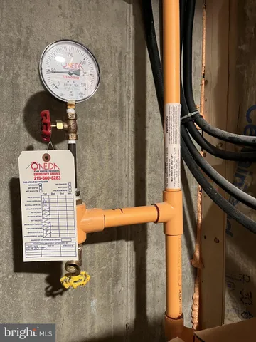 a view of a terrace with furniture and a gate