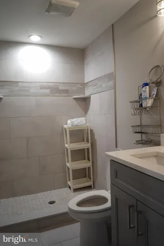 a kitchen with stainless steel appliances a refrigerator sink and stove