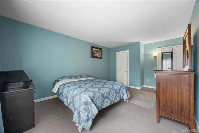 a bedroom with a bed and cabinets