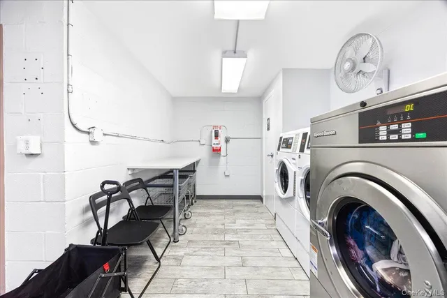 a view of livingroom with washer and dryer