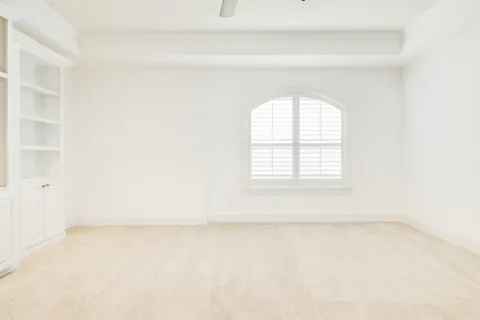 a bathroom with a granite countertop sink a toilet and a bathtub