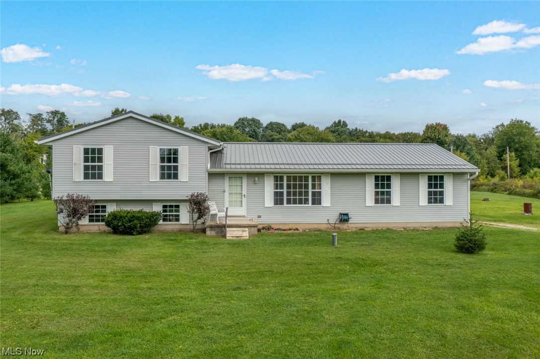 8045 State Rte 5 Ravenna, OH 44266 - Photo 1 of 32 Tri-level home featuring a front lawn