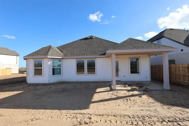 a utility room with sink dryer and washer