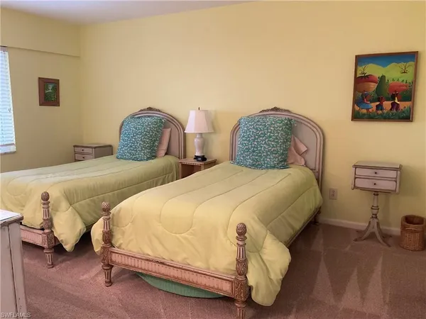 a room with a mirror and a lamp