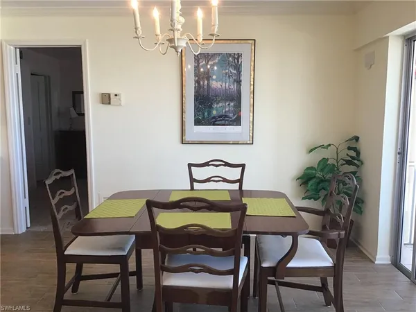 a bed sitting in a bedroom next to a lamp