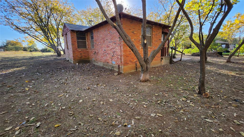 2518 Laney Road Denton, TX 76208 - Photo 8 of 12 a view of a house with a yard