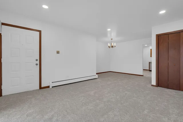 an empty room with a ceiling fan