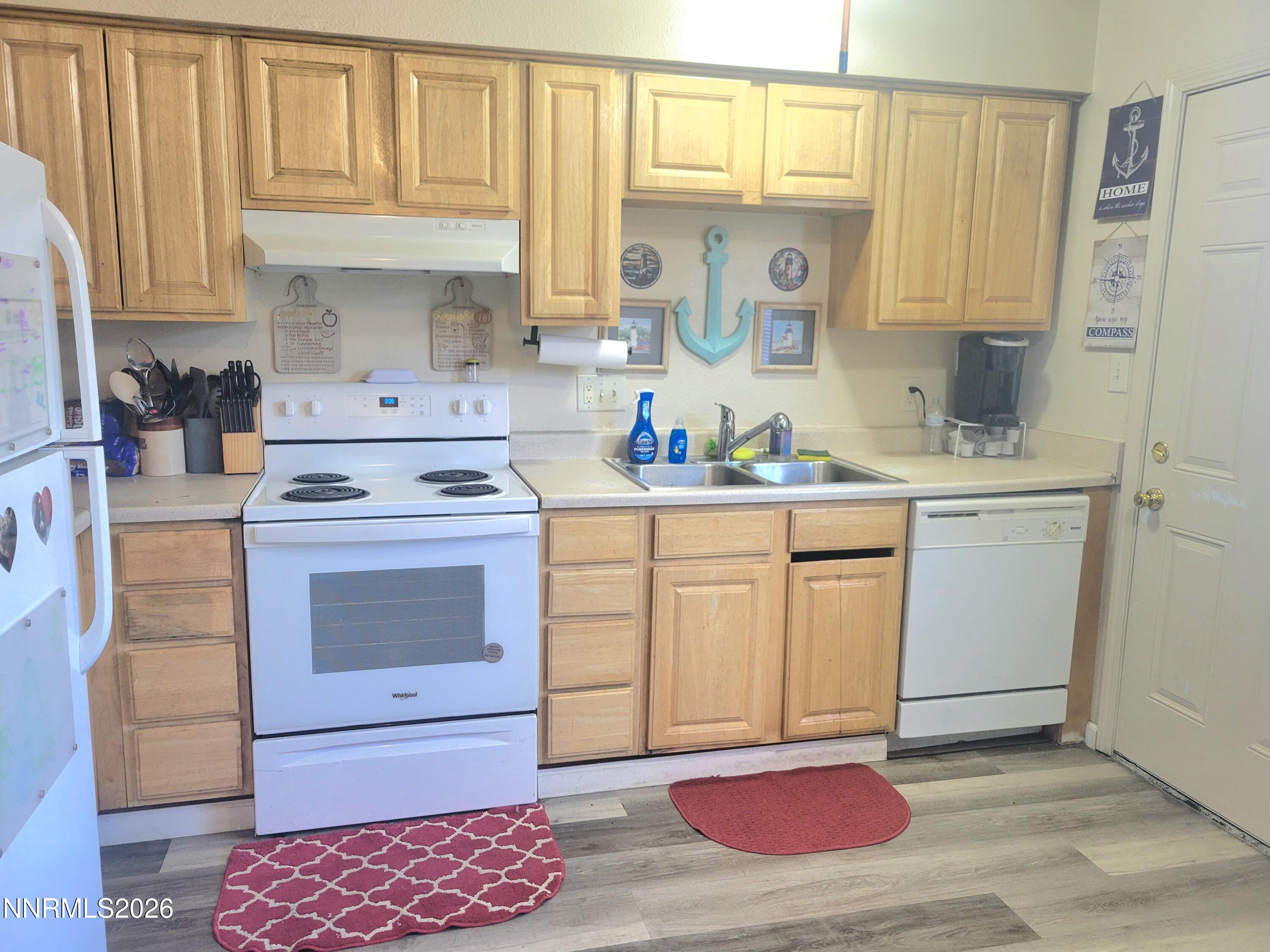 1404 East 9th Street, Unit 3 Reno, NV 89512 - Photo 7 of 29 a kitchen with a sink stove and cabinets