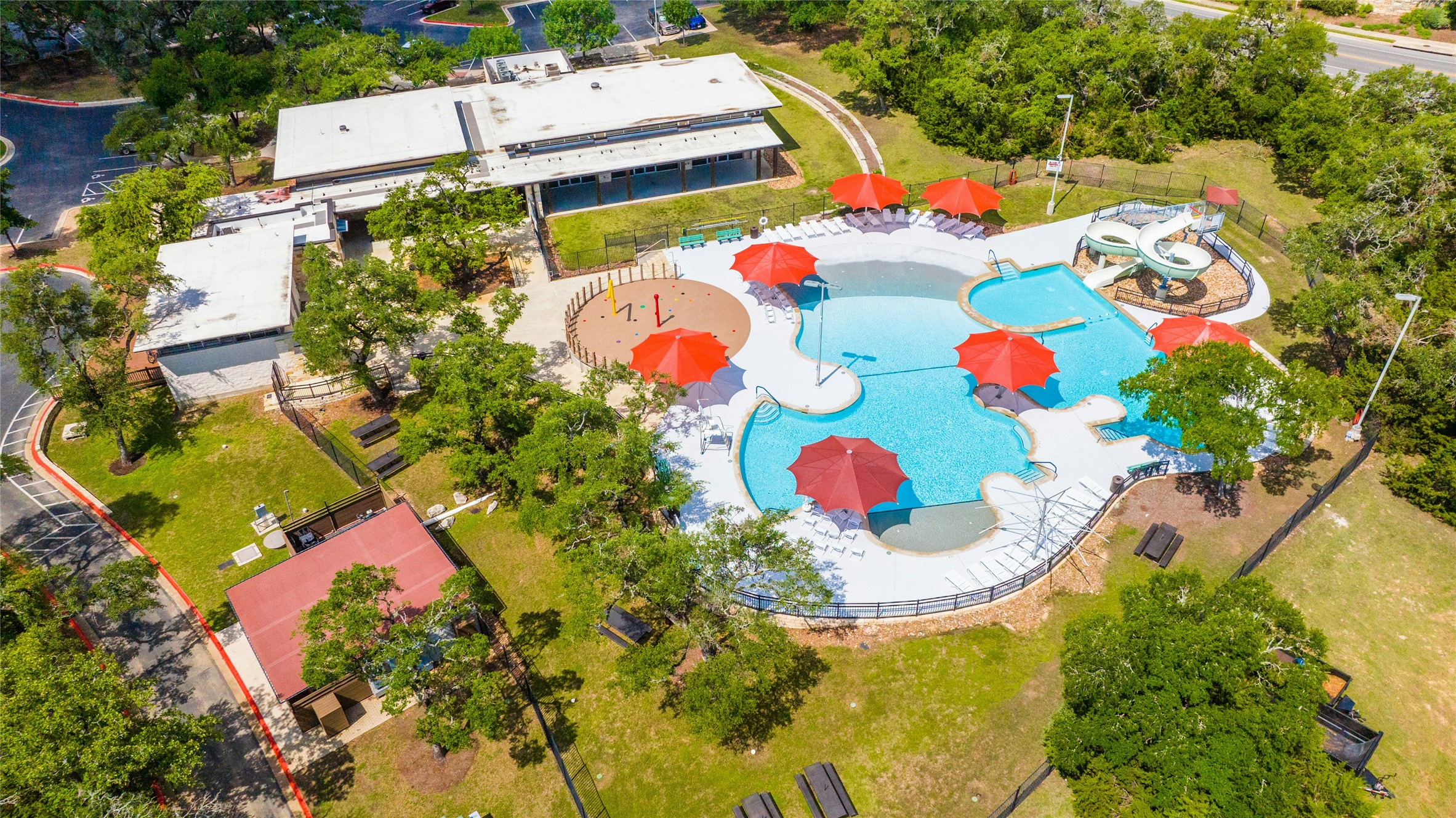 10902 Beacham Court Austin, TX 78739 - Photo 28 of 32 Circle C Community Center and Community Center Pool with Slide, Beach Entry and Splash Pad.
