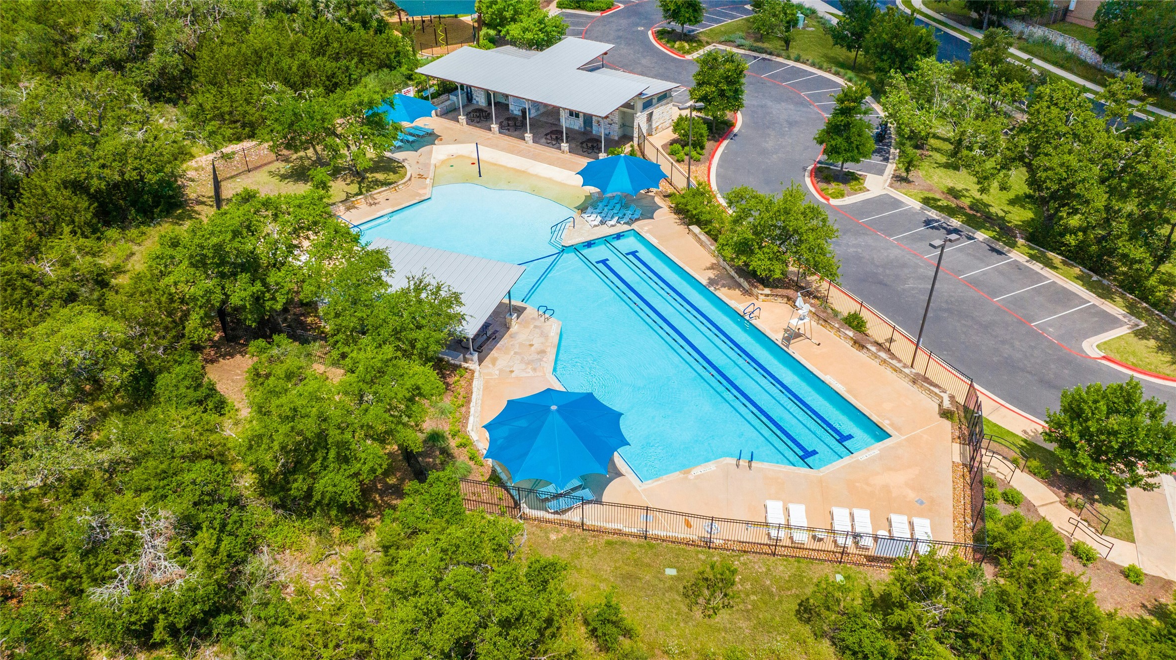10902 Beacham Court Austin, TX 78739 - Photo 29 of 32 Circle C Avana Pool with Beach Entry, Covered Seating and Lap Lanes