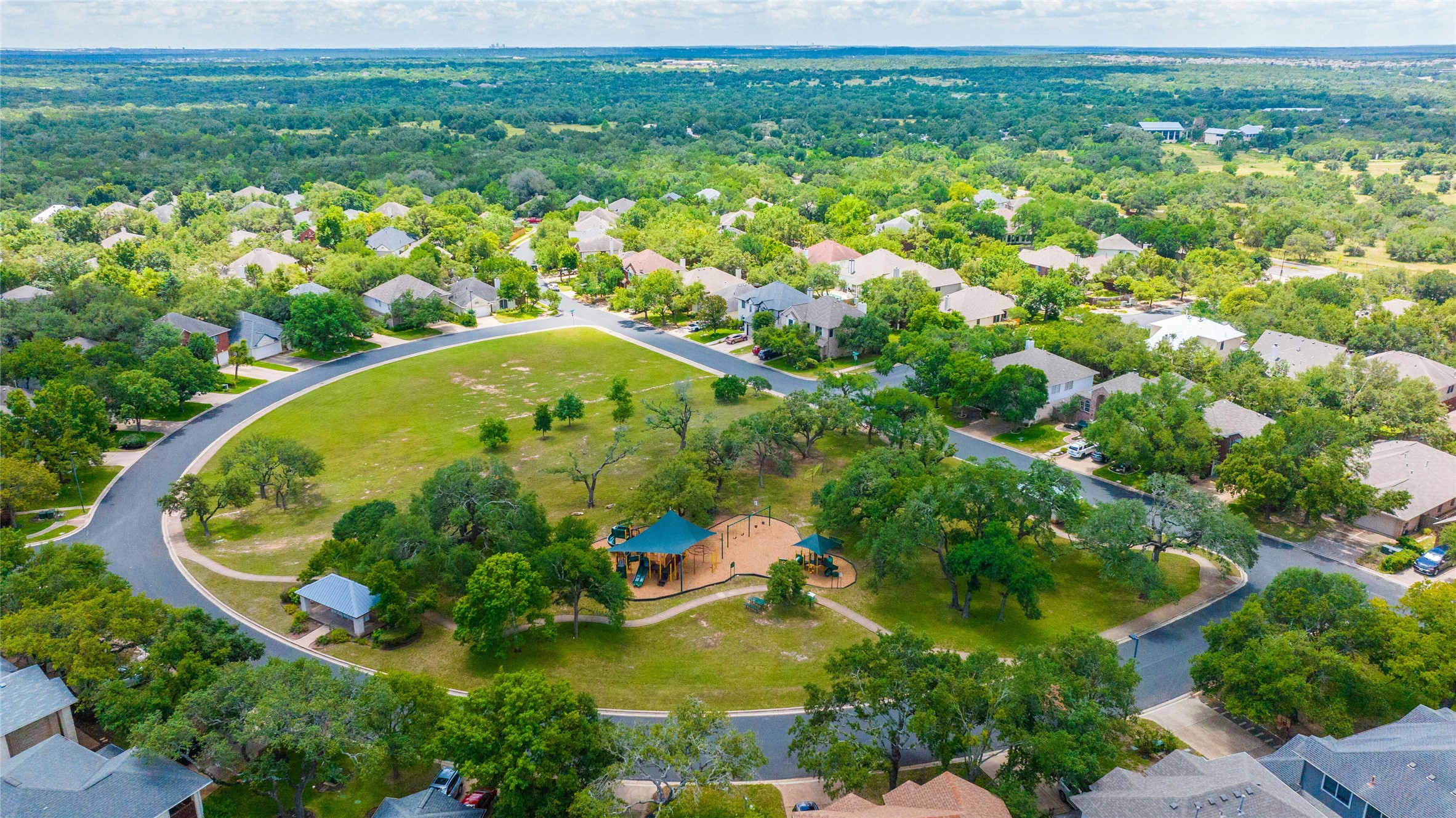 10902 Beacham Court Austin, TX 78739 - Photo 31 of 32 Circle C Wildflower Park Playscape and Open Field