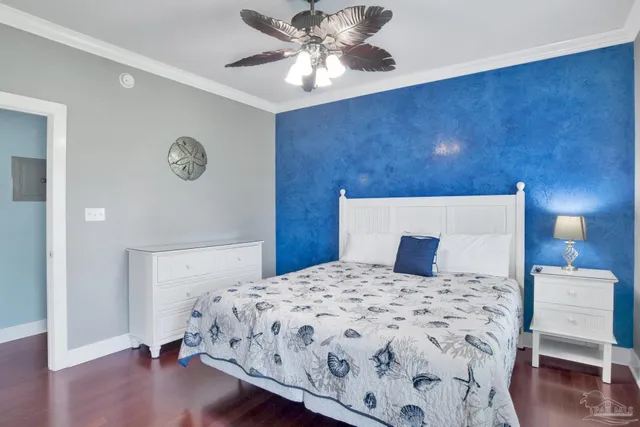 a bedroom with a bed and a lamp