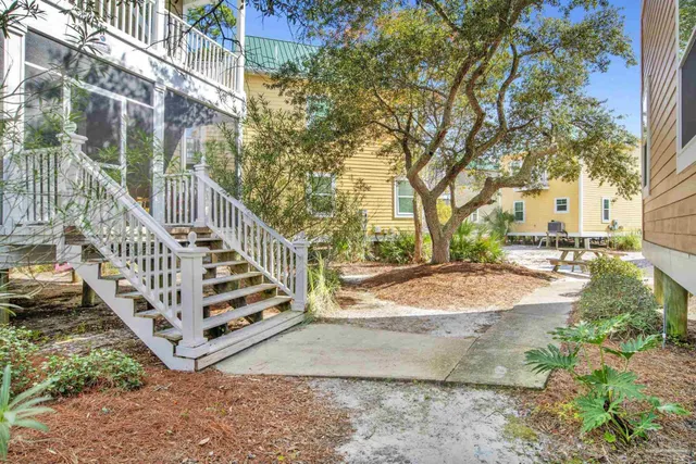 a backyard of a building with lots of trees