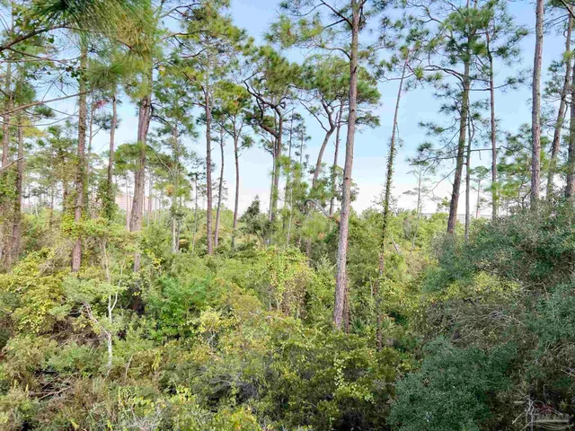a view of a swimming pool with an outdoor space and seating area